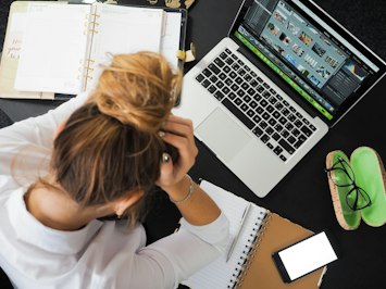 Overworked and Overwhelmed: Adjusters Voice Concerns Over High Claim Volumes - Insurance Claims News Article