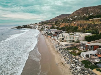Coastal Flooding Collapses Driveway at Nicolas Cage’s Malibu Home - Insurance Claims News Article