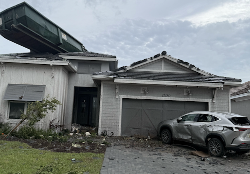 Tornado Sends Industrial Dumpster Onto Roof in Palm Beach Gardens Neighborhood