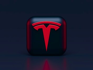 Tesla Driver Sues In Death Of Wife In Crash With Parked Emergency Vehicle - Insurance Claims News Article